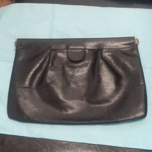 Black 100 percent leather ladies clutch